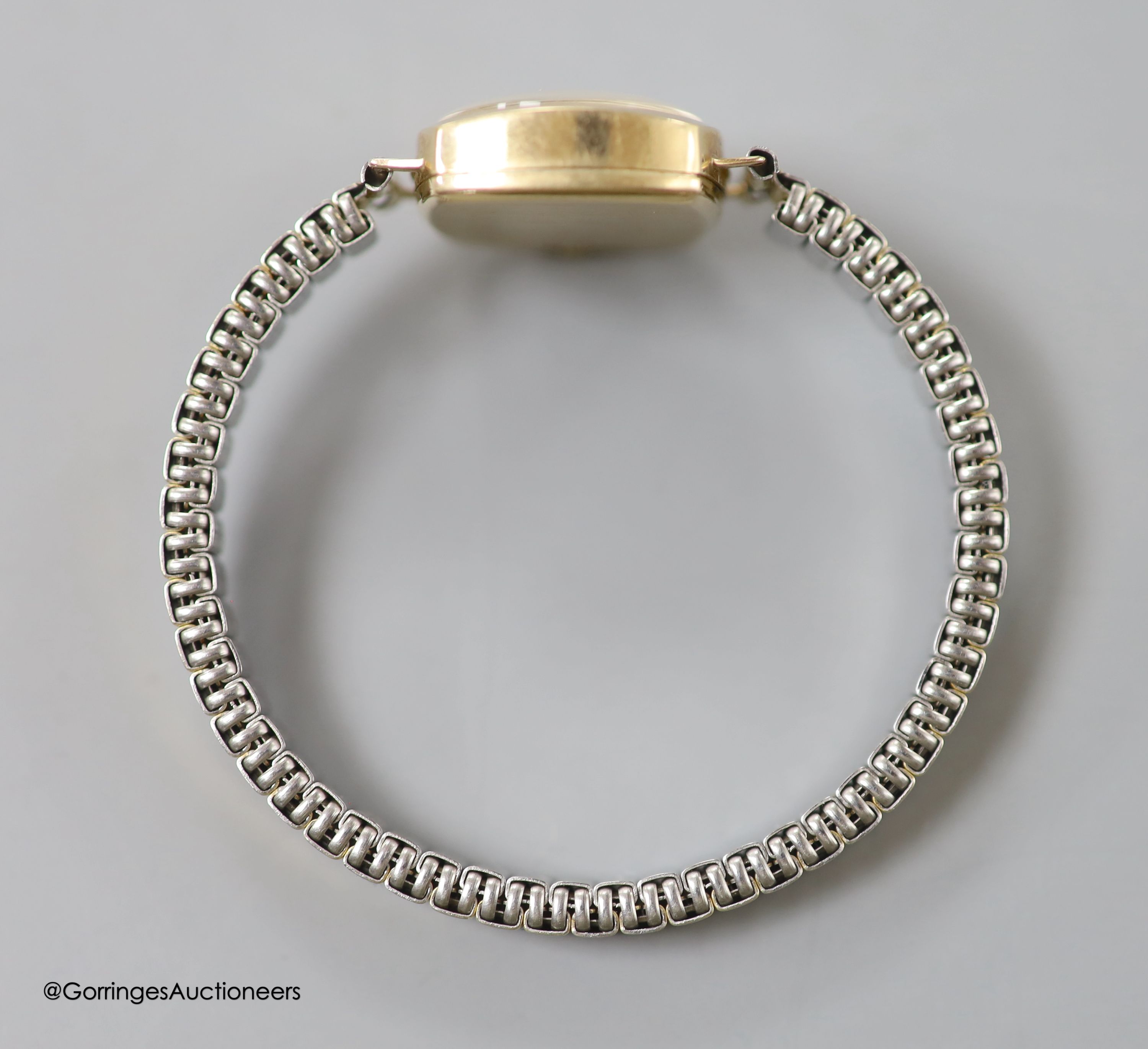 A lady's 9ct gold Vertex manual wind wrist watch, on a rolled gold mesh link bracelet and a similar 9ct gold watch on gold plated flexible bracelet, gross 33 grams.